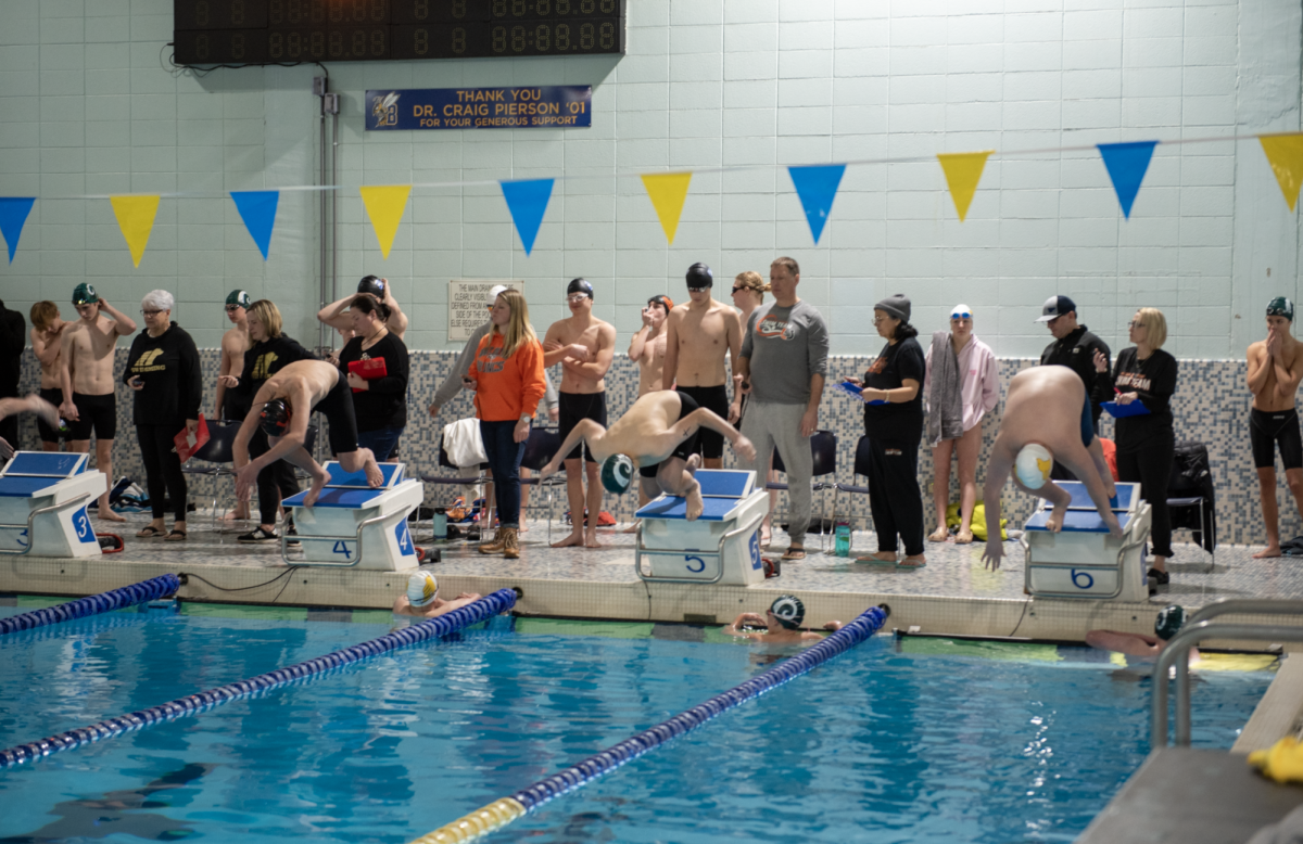 1.20.25 Freshman Aiden McLain starts from the block for his 100 yard freestyle. 